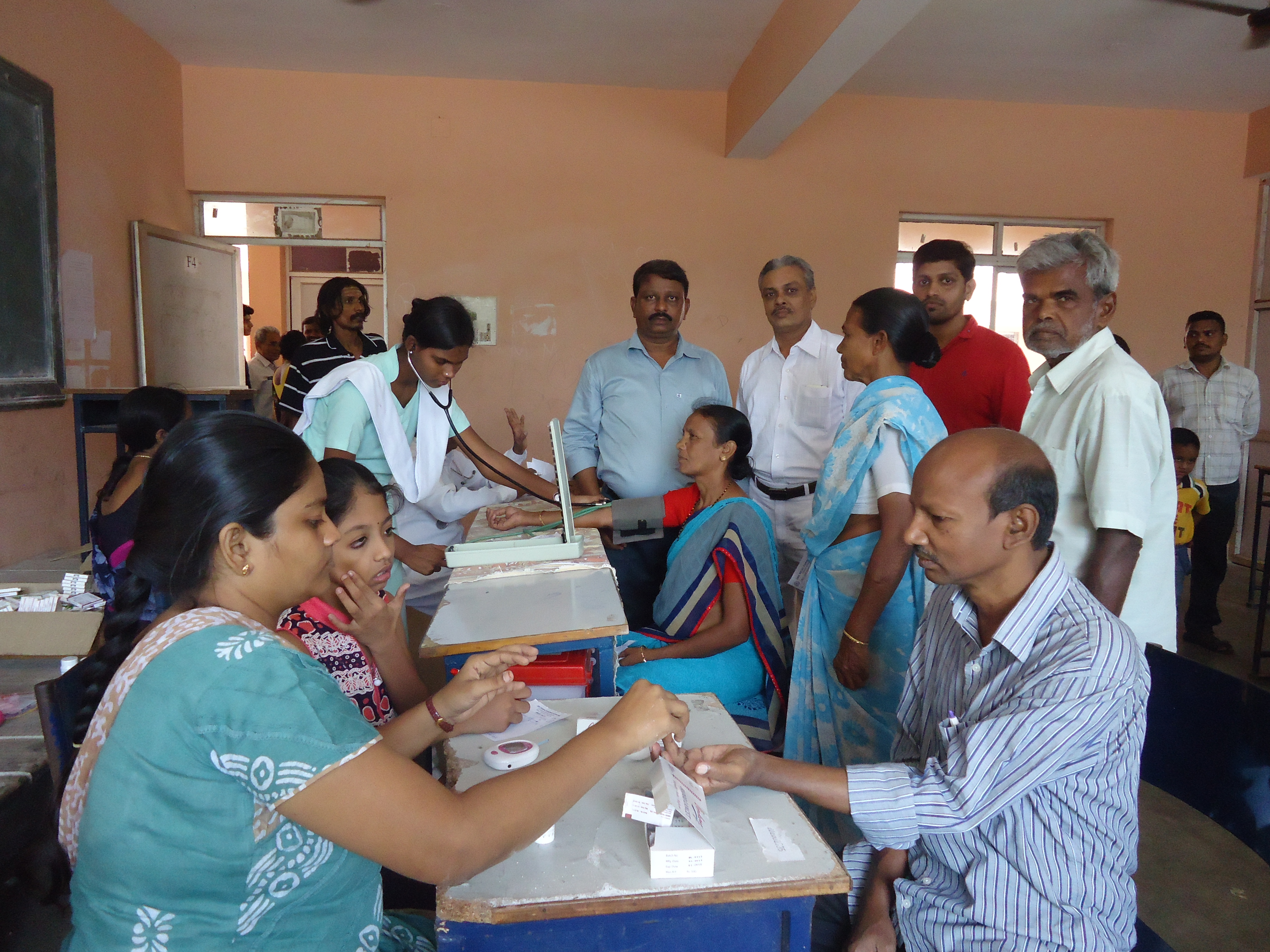 Patient receiving an eye check at a medical camp