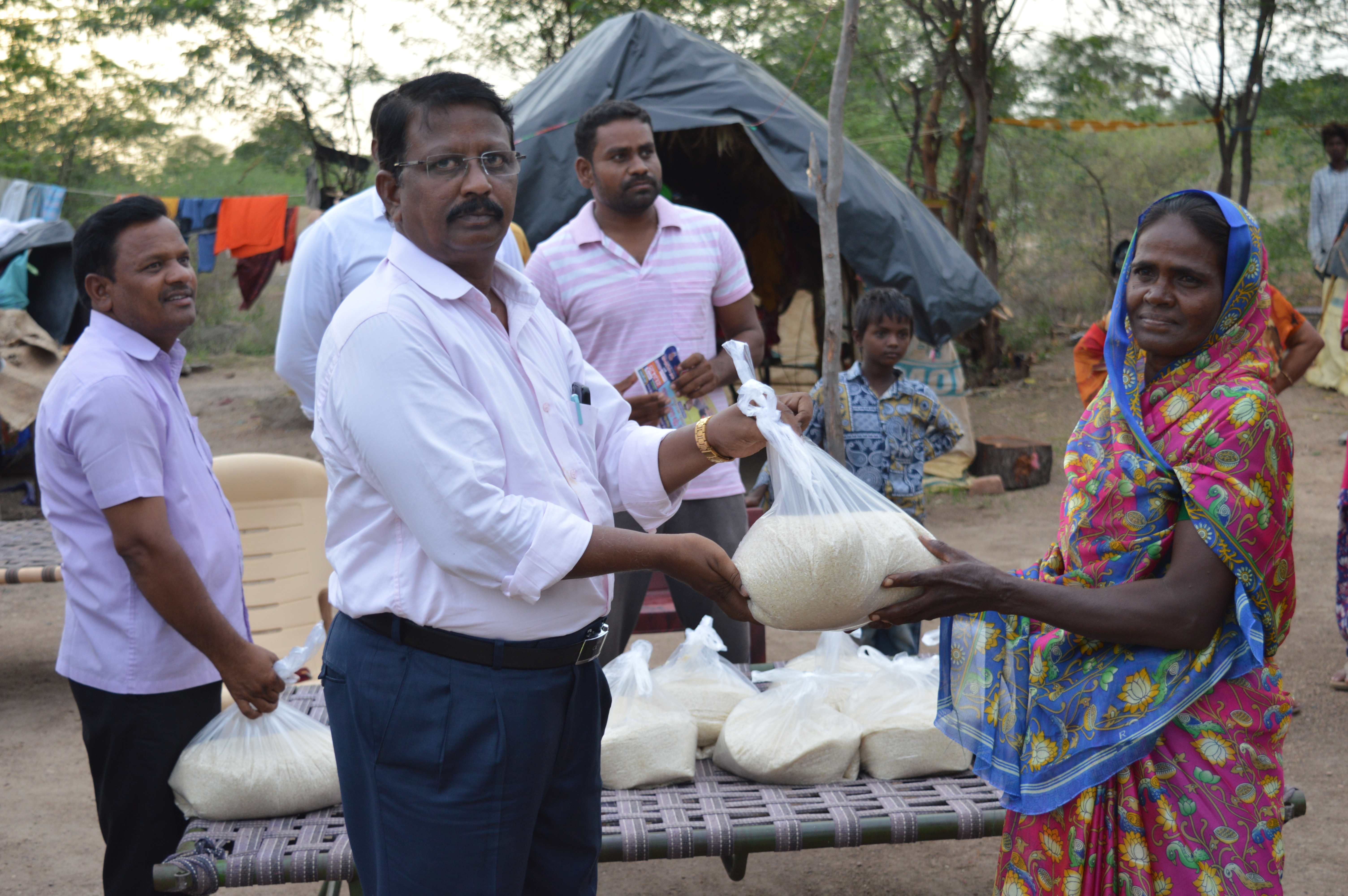 Distributing rice to a family